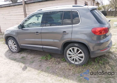 2014 Volkswagen Tiguan Sel z USA, uszkodzony, nr VIN WVGAV3AXXEW059222